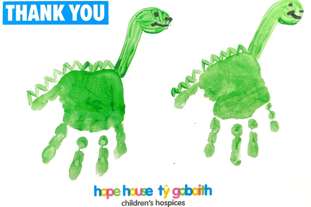 thank you post card from Ty Gobaith with dinosaur hand prints