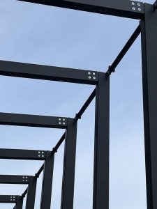 structural steel frame detailing against blue sky Old library Creative hub Wrexham